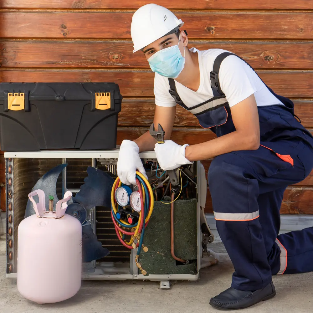 Hot and Cool HVAC technician inspecting a residential furnace unit