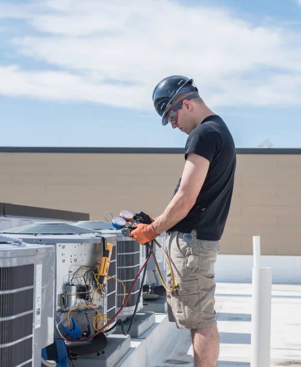 Hot and Cool HVAC technician completing a home service call in Calgary
